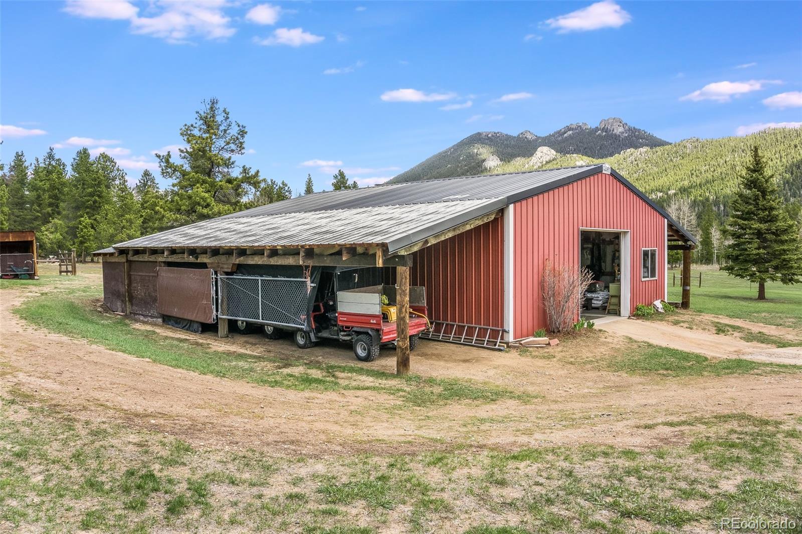 104 Mountain House Road Black Hawk, CO 80422 - Photo 21 of 32 a view of a house with backyard and sitting area