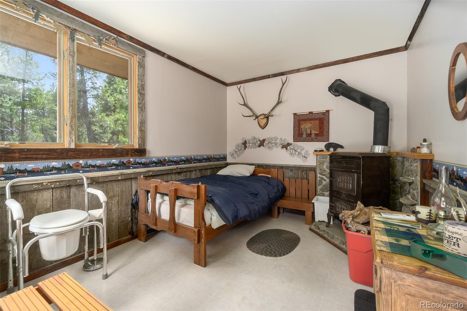 104 Mountain House Road Black Hawk, CO 80422 - Photo 25 of 32 a living room with furniture and a window