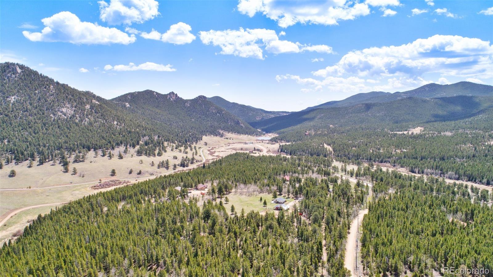 104 Mountain House Road Black Hawk, CO 80422 - Photo 30 of 32 a view of a lake with mountains in the background