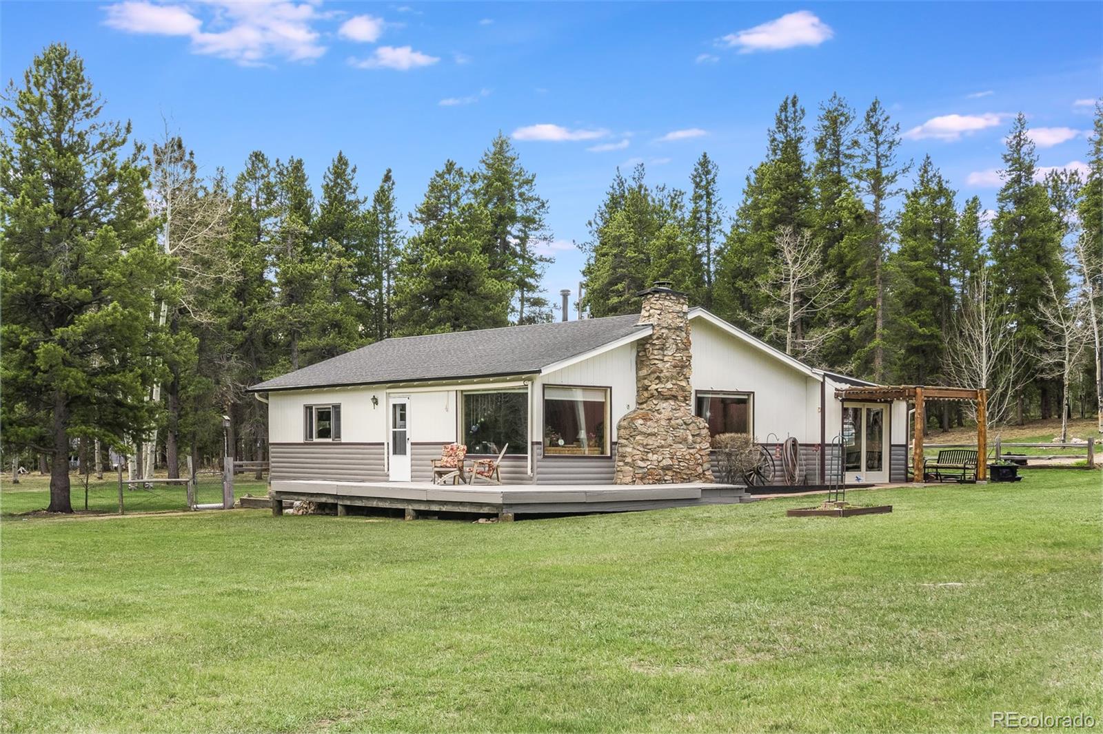 104 Mountain House Road Black Hawk, CO 80422 - Photo 4 of 32 a front view of house with yard and green space
