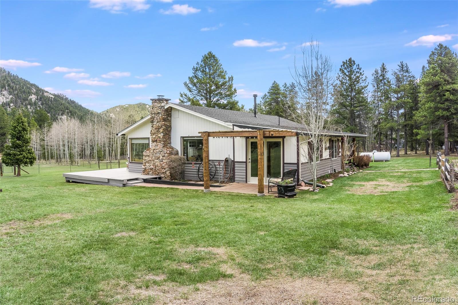 104 Mountain House Road Black Hawk, CO 80422 - Photo 5 of 32 a view of a house with backyard porch and sitting area