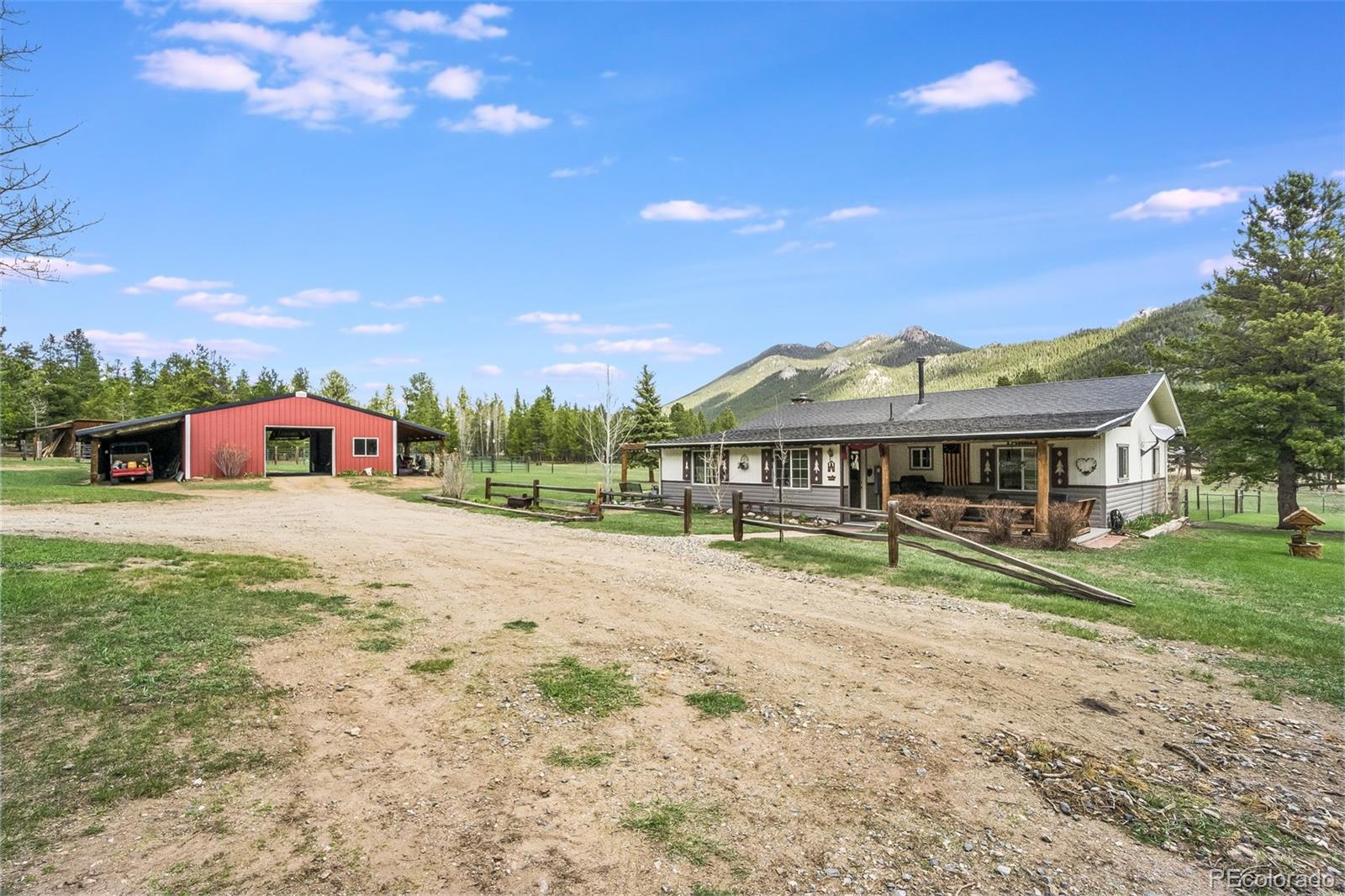 104 Mountain House Road Black Hawk, CO 80422 - Photo 7 of 32 a view of a house with a yard and sitting area
