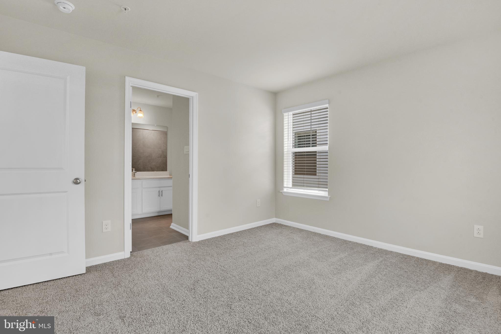 454 Hanson Street Frederick, MD 21701 - Photo 17 of 45 an empty room with a bathroom and a window