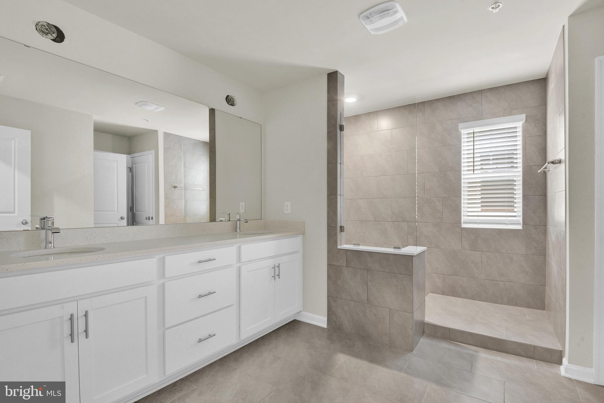 454 Hanson Street Frederick, MD 21701 - Photo 25 of 45 a bathroom with a granite countertop sink mirror and double