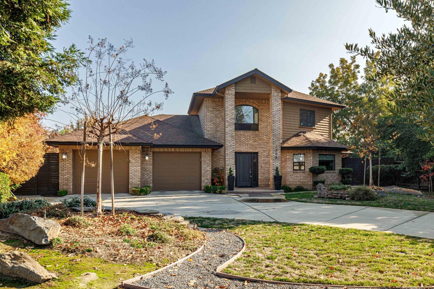 1308 Poust Road Modesto, CA 95358 - Photo 1 of 1 a front view of a house with a yard