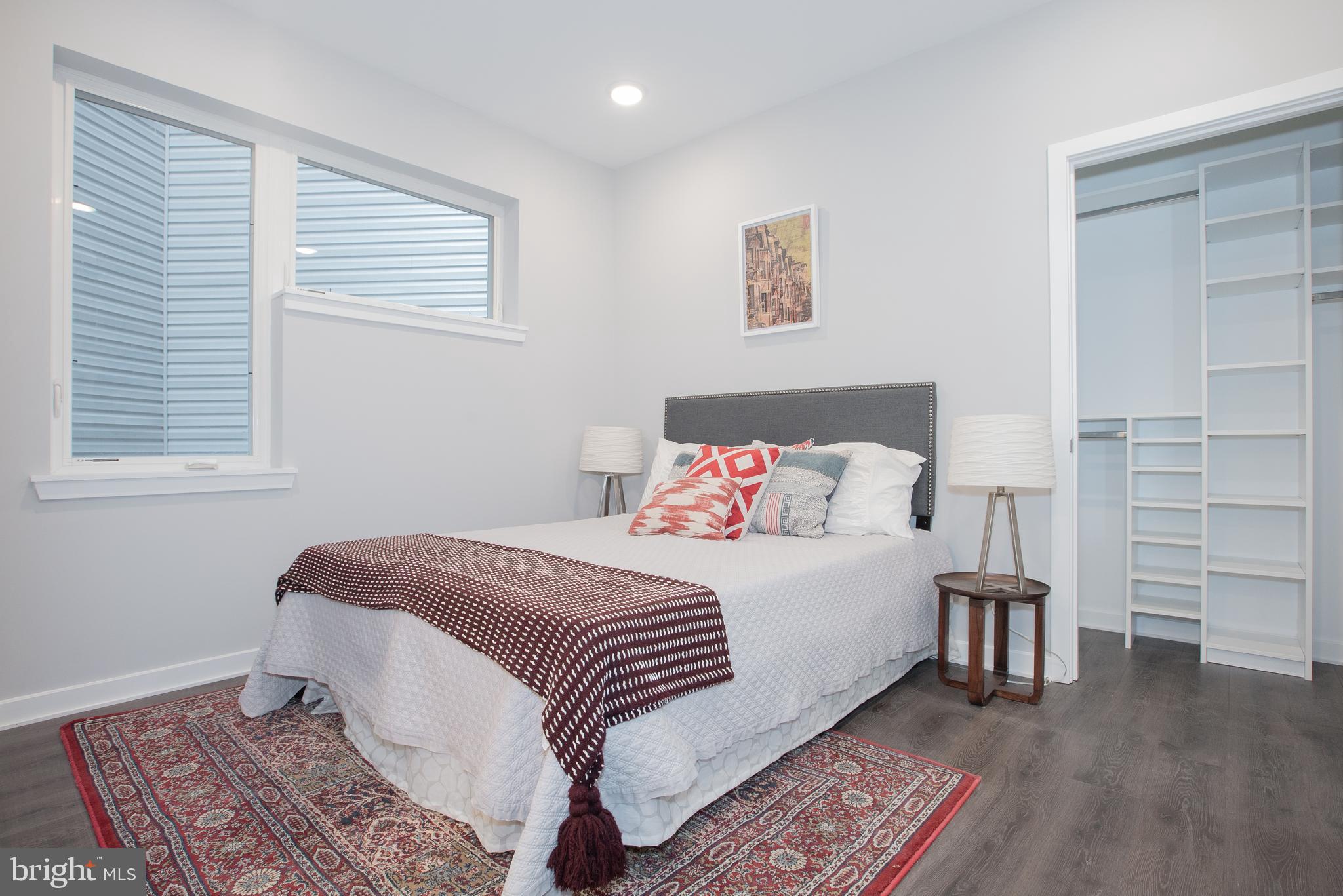 1534 Ridge Avenue, Unit 202 Philadelphia, PA 19130 - Photo 17 of 20 a bedroom with a bed and a walk in closet