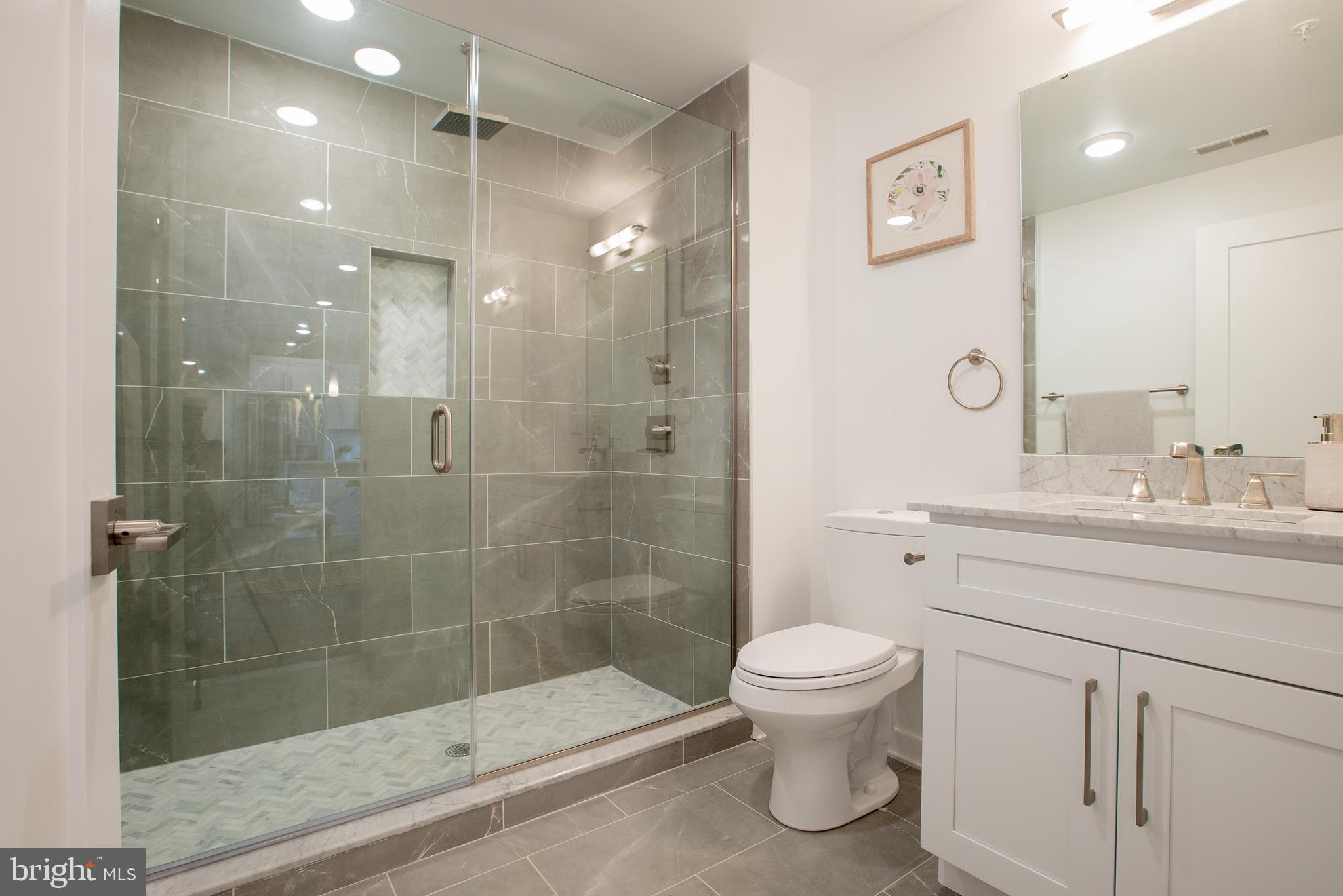 1534 Ridge Avenue, Unit 202 Philadelphia, PA 19130 - Photo 8 of 20 a bathroom with a sink a toilet and shower