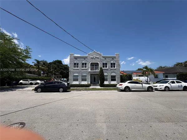 a view of a cars parked in front of a house