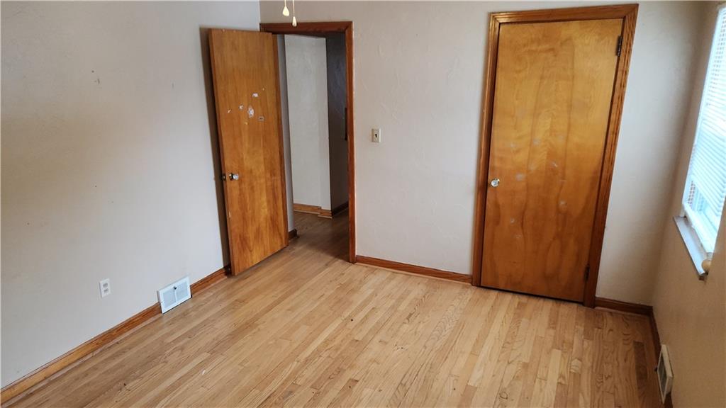 468 North Pike Road Sarver, PA 16055 - Photo 11 of 18 an empty room with wooden floor and a window