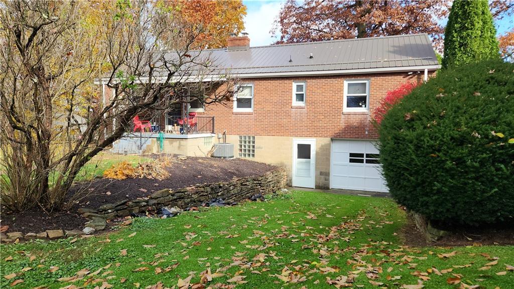 468 North Pike Road Sarver, PA 16055 - Photo 3 of 18 a view of a house with a small yard and a large tree
