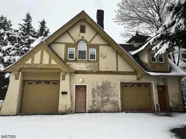 a front view of a house with a garage