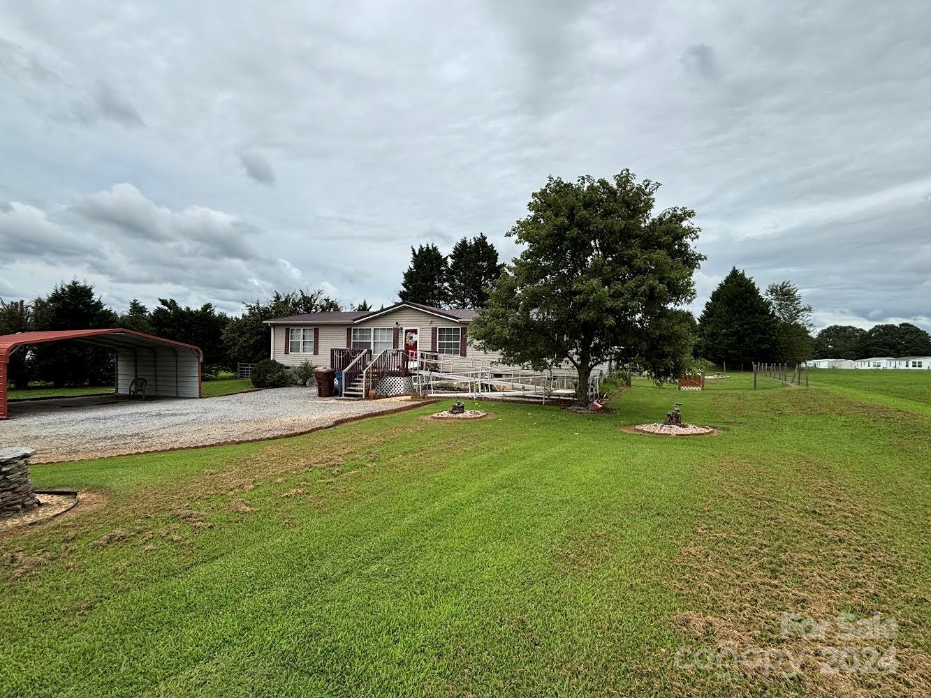 4812 Rifle Range Road Conover, NC 28613 - Photo 3 of 7 a view of a swimming pool with a yard