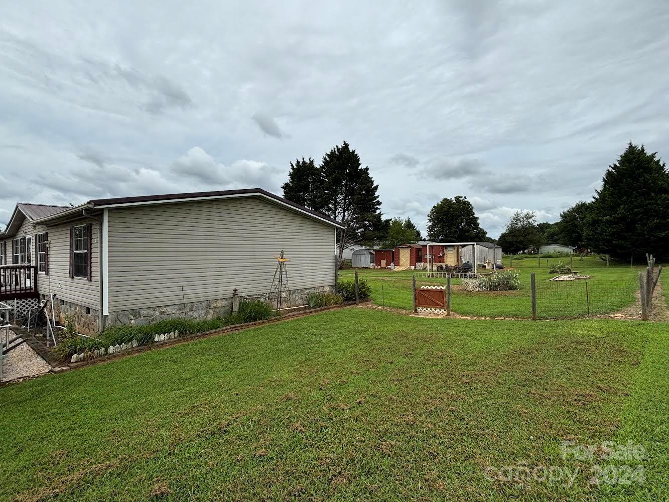 4812 Rifle Range Road Conover, NC 28613 - Photo 4 of 7 a house view with a garden space