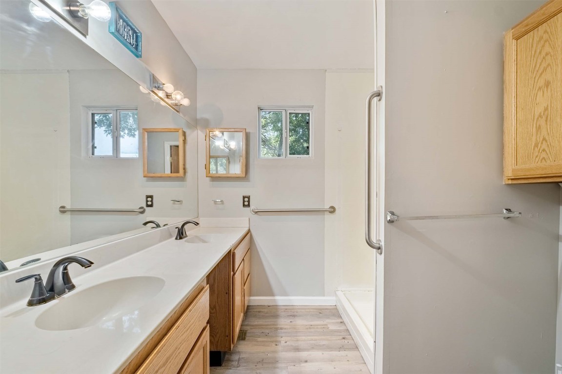 2502 Cypress Lane Cedar Park, TX 78613 - Photo 20 of 25 a bathroom with a sink and a mirror