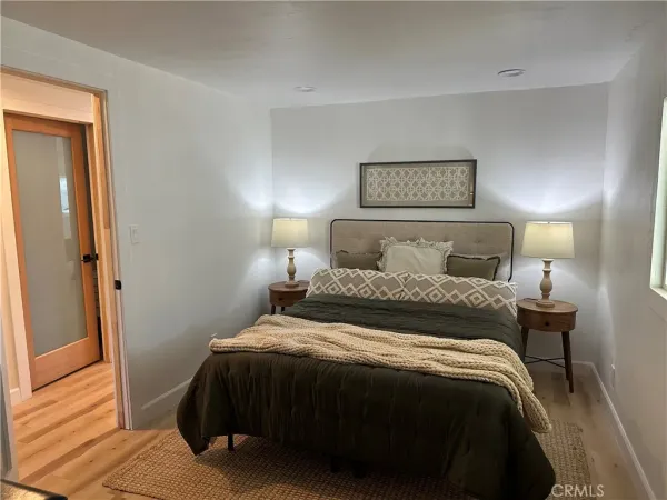 a bedroom with a bed and a walk in closet