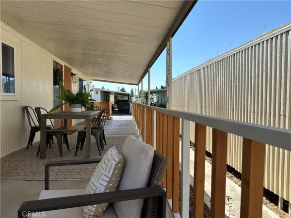 a view of a chairs and table in patio