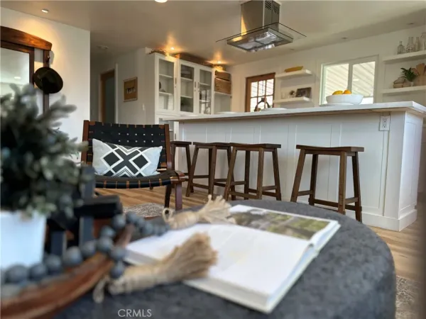 a view of a living room and kitchen