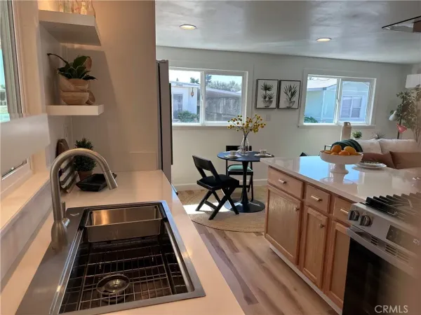 a kitchen with a stove and a refrigerator
