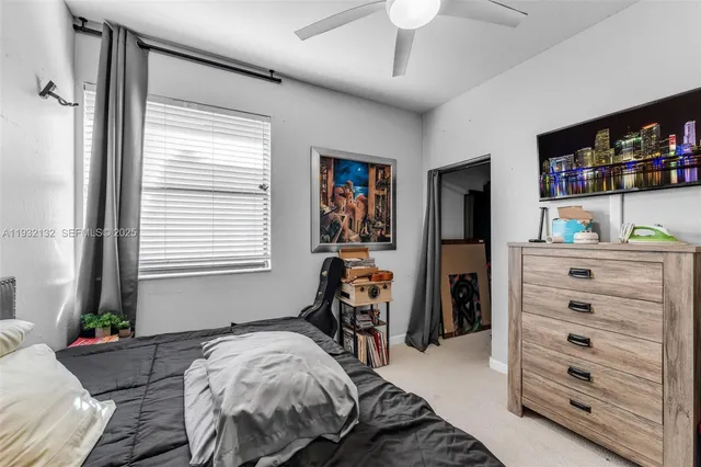 a bed room with a bed and a window