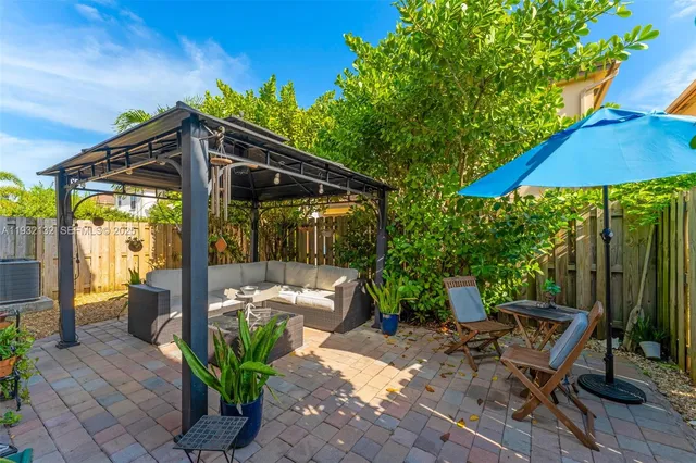 a chair and tables in the patio