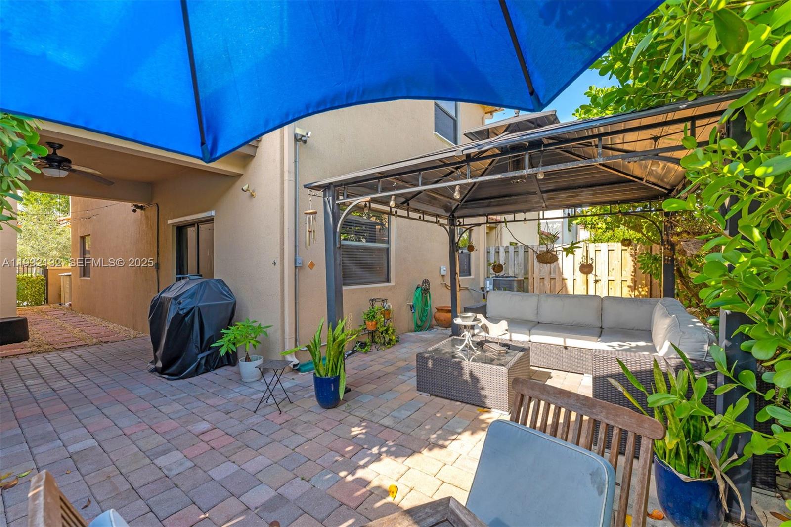 22813 Southwest 88th Path Cutler Bay, FL 33190 - Photo 15 of 24 a view of a chairs and table in the patio