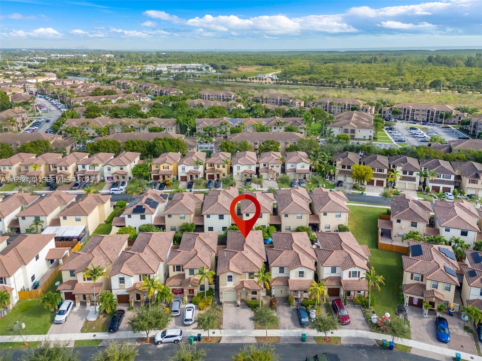 22813 Southwest 88th Path Cutler Bay, FL 33190 - Photo 17 of 24 an aerial view of a city