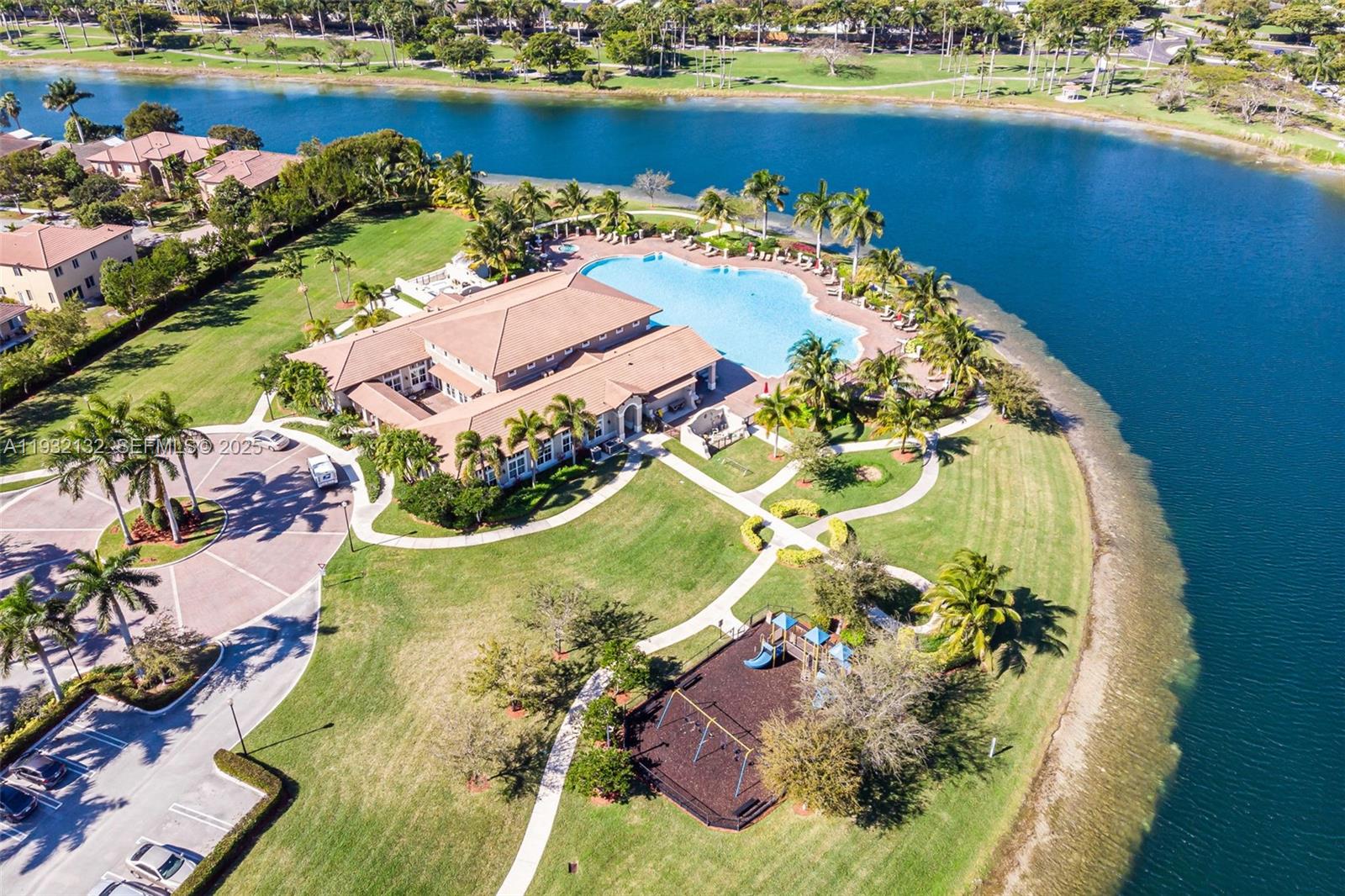22813 Southwest 88th Path Cutler Bay, FL 33190 - Photo 20 of 24 an aerial view of a house with a lake view