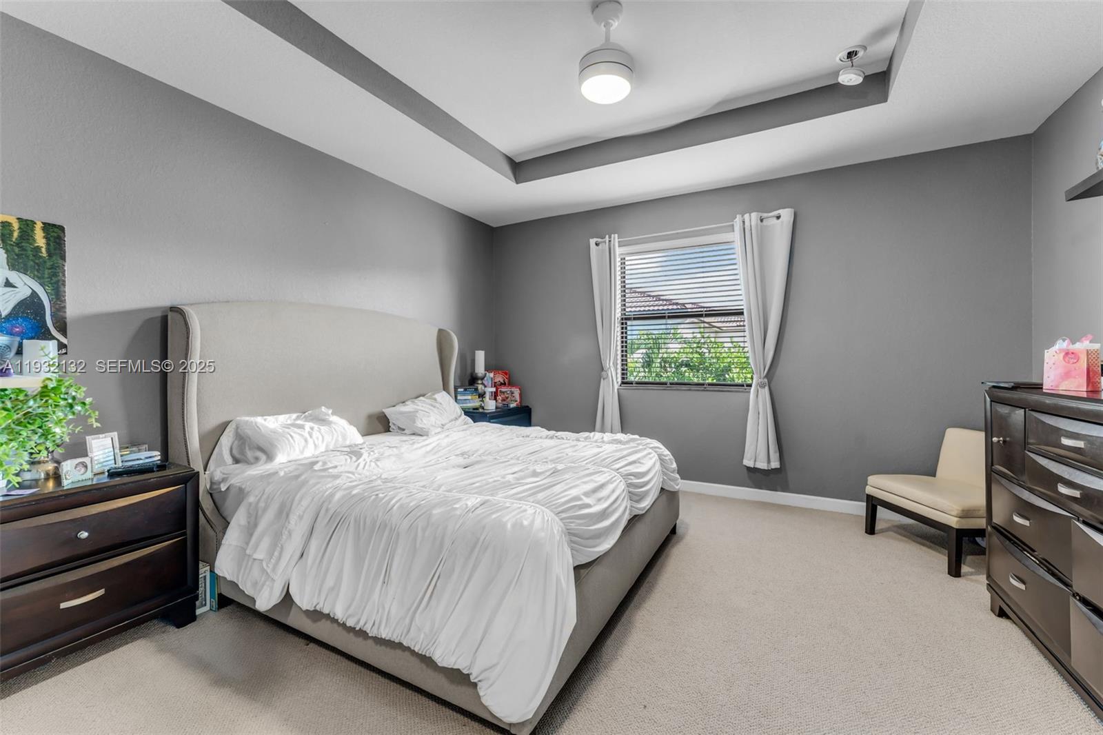 22813 Southwest 88th Path Cutler Bay, FL 33190 - Photo 7 of 24 a bedroom with a bed and a window