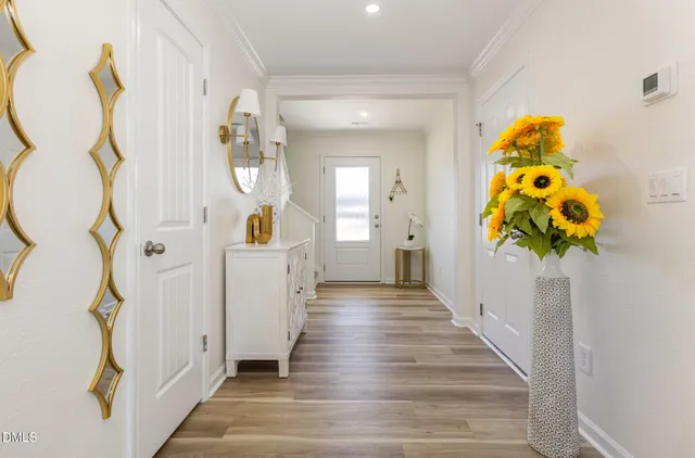 a view of an entryway with wooden floor