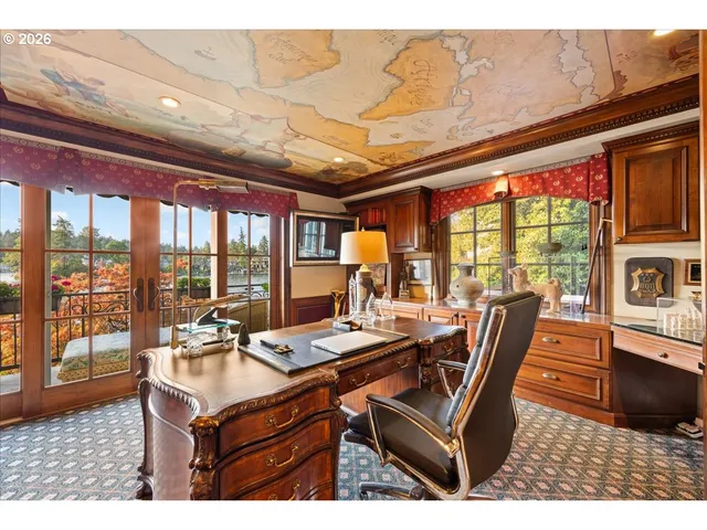 a room with furniture and large windows