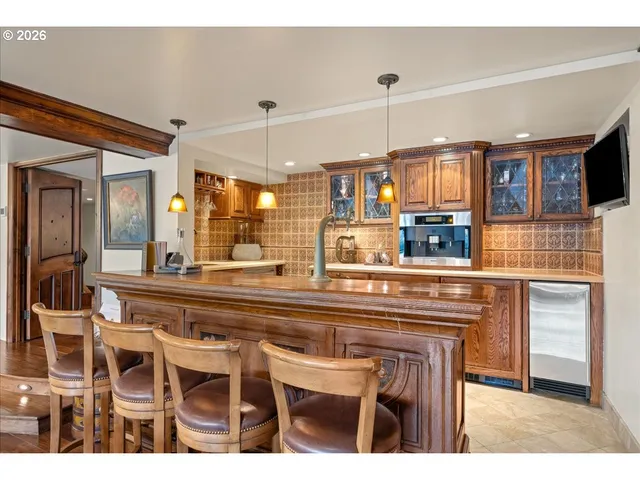 a kitchen with a sink cabinets and window
