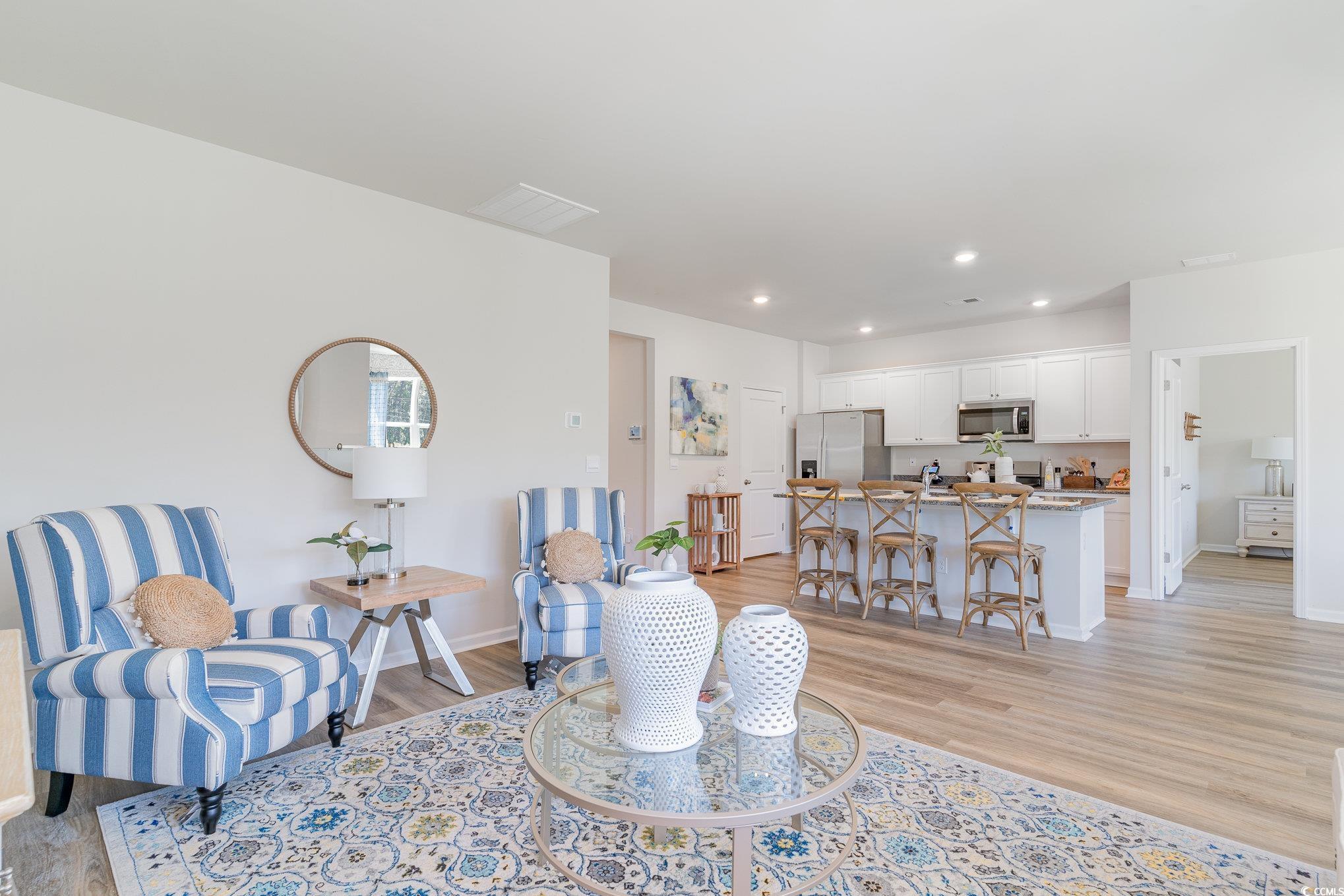 7366 Meadow Walk Loop Loris, SC 29569 - Photo 8 of 20 Living area featuring light wood-type flooring and recessed lighting