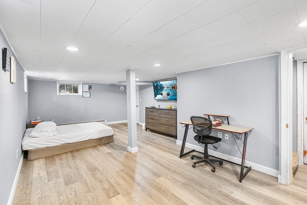 3 Fitz Road Peabody, MA 01960 - Photo 23 of 34 a bedroom with a bed and a desk