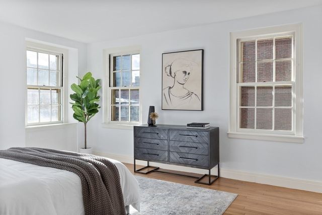 a bedroom with a bed and a fireplace