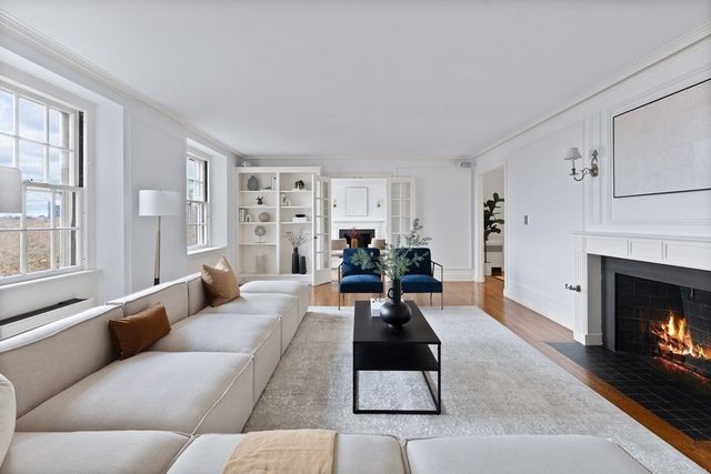 a living room with furniture or couch and a fireplace