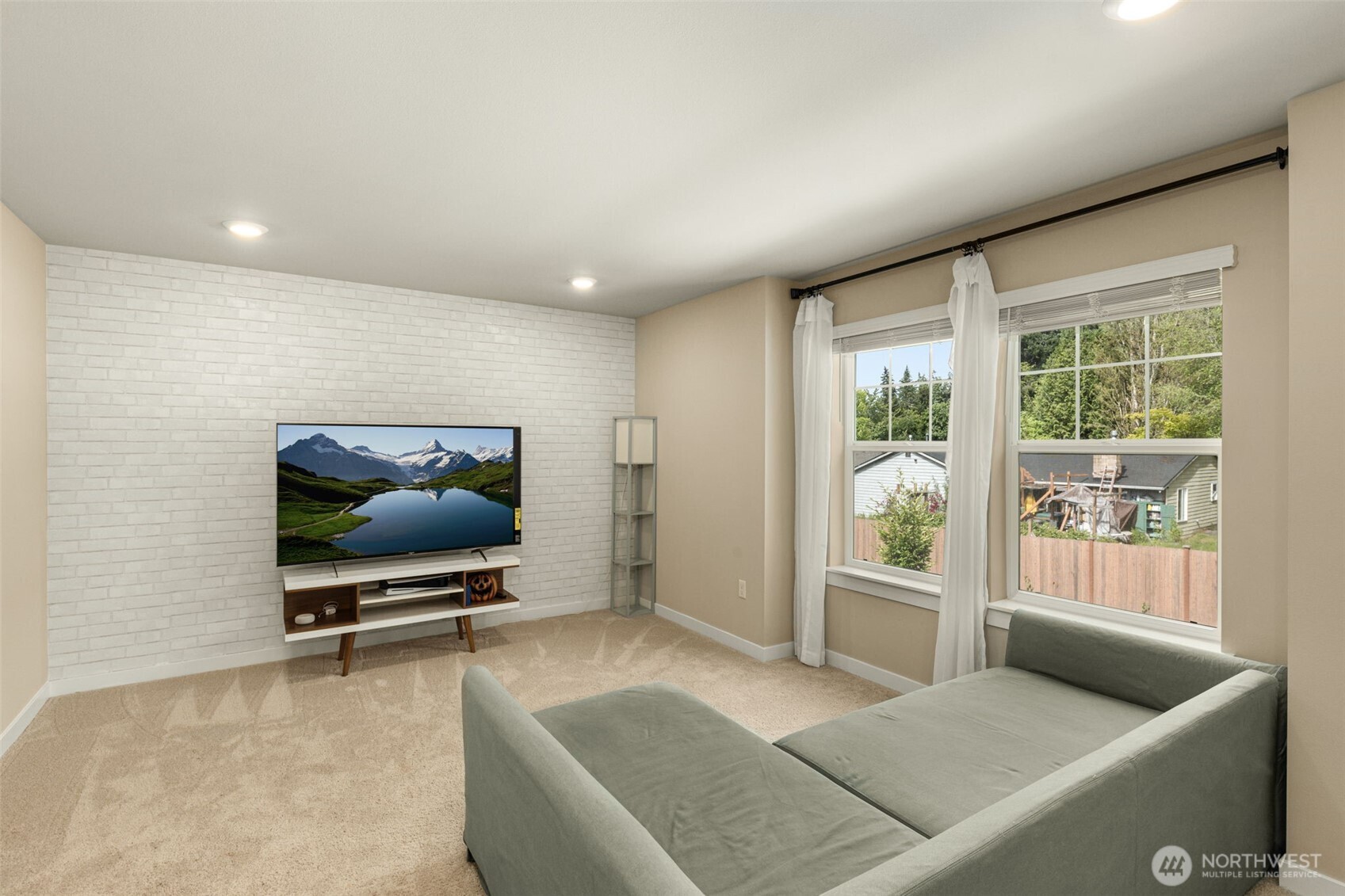 19410 28th Drive Southeast Bothell, WA 98012 - Photo 28 of 37 a living room with furniture and a flat screen tv