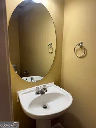 a bathroom with a sink and mirror