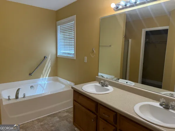 a bathroom with a sink and a bathtub