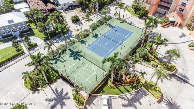 an aerial view of a house with a yard and garden