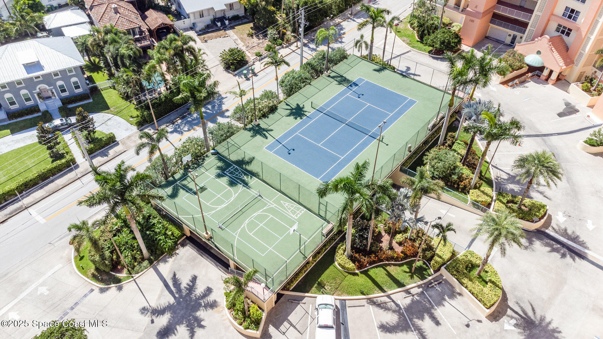 102 Riverside Drive, Unit 203 Cocoa, FL 32922 - Photo 16 of 26 an aerial view of a house with a yard and garden