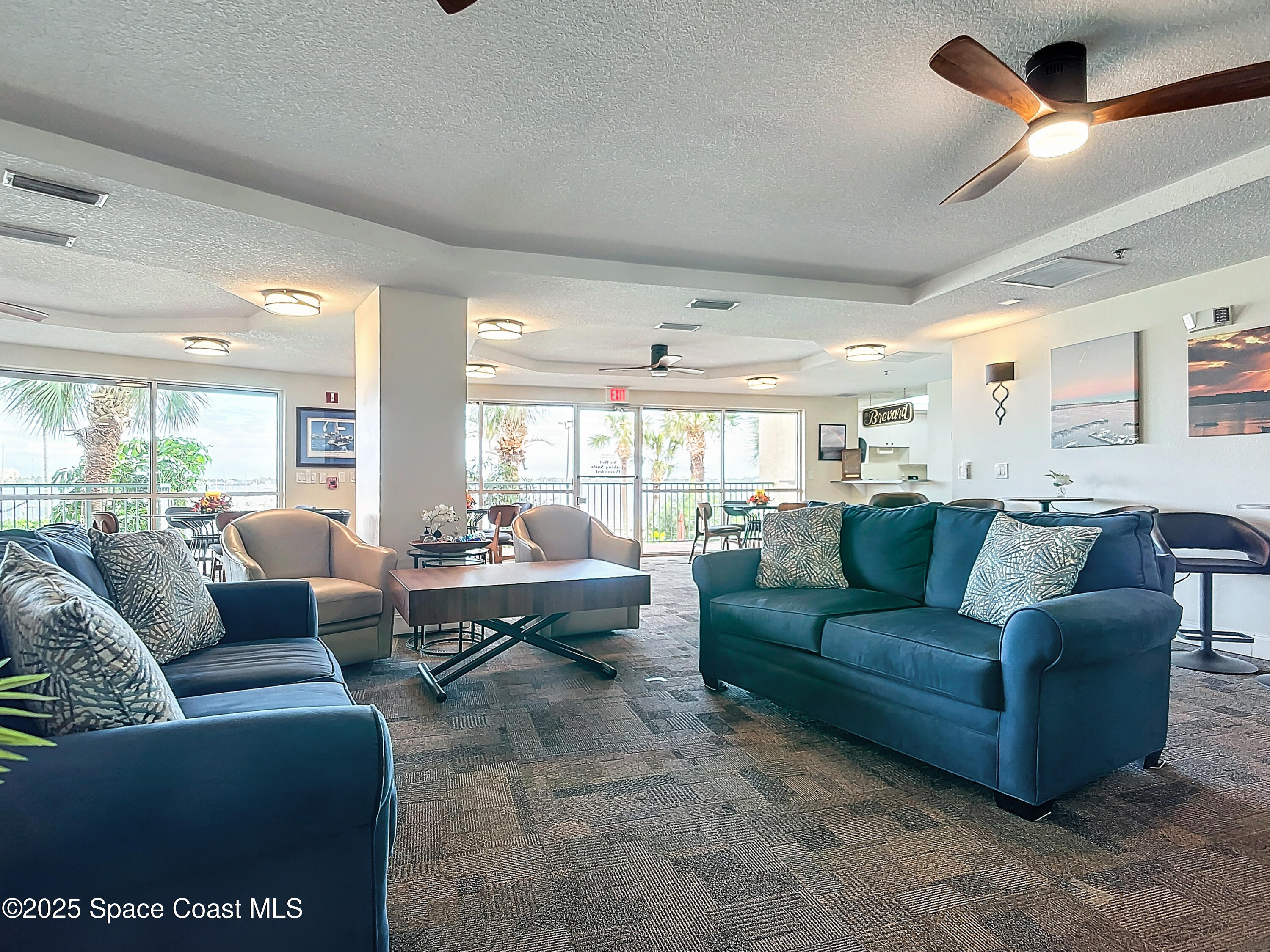 102 Riverside Drive, Unit 203 Cocoa, FL 32922 - Photo 19 of 26 a living room with furniture wooden floor and ceiling fan