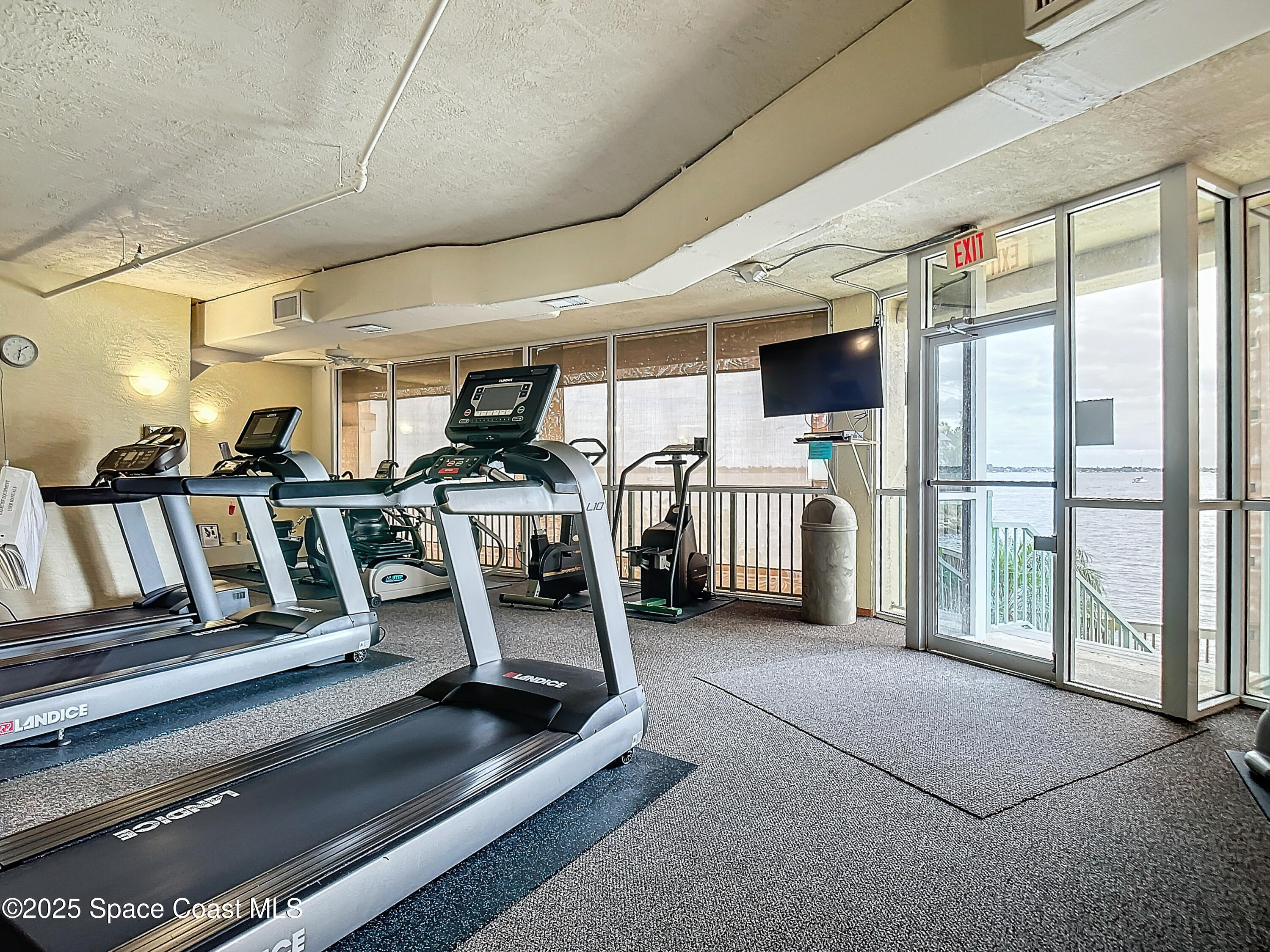102 Riverside Drive, Unit 203 Cocoa, FL 32922 - Photo 21 of 26 a view of a room with gym equipment