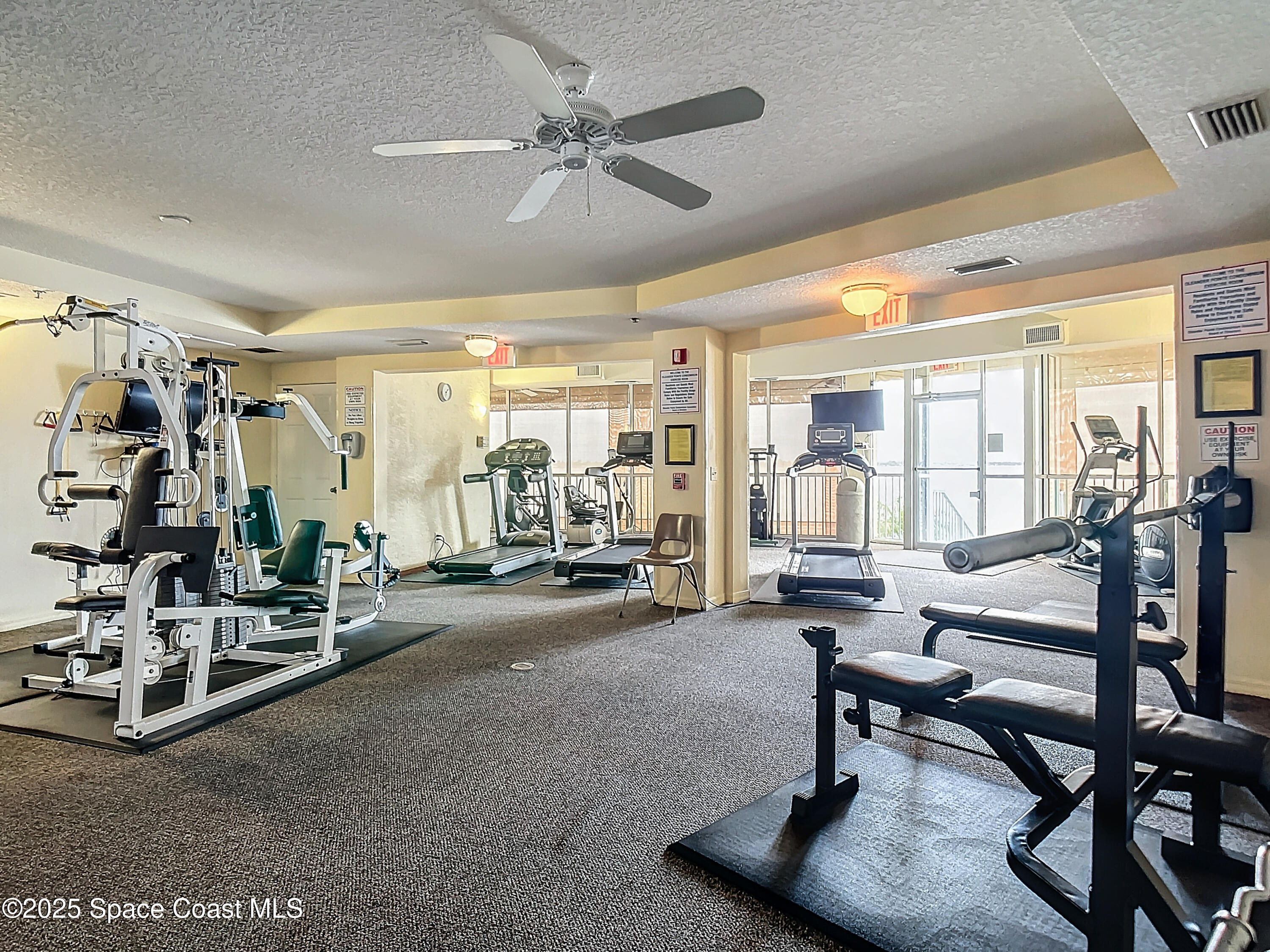 102 Riverside Drive, Unit 203 Cocoa, FL 32922 - Photo 22 of 26 a view of a room with gym equipment
