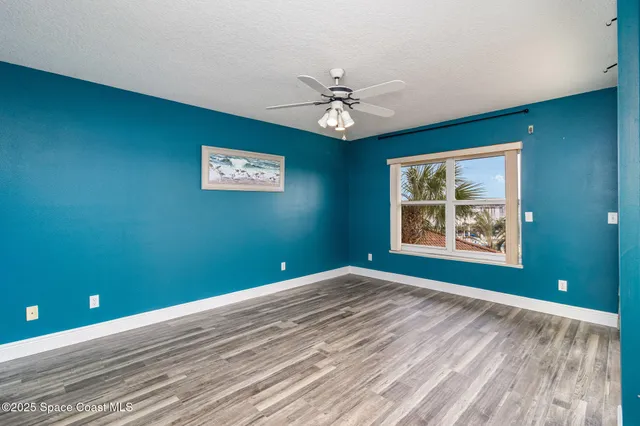 wooden floor in a room next to a window
