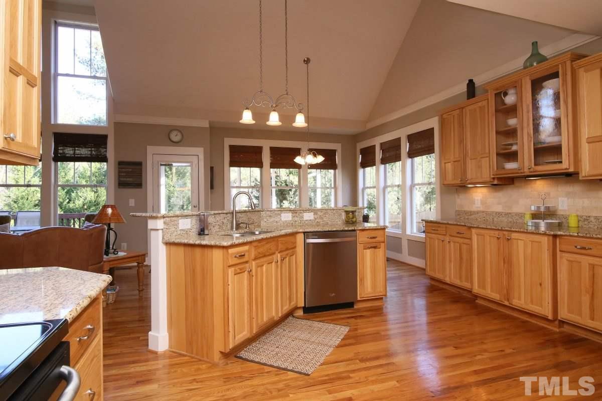 1128 Coram Fields Road Wake Forest, NC 27587 - Photo 10 of 25 Great for entertaining, this kitchen is open to the family room and dining room!