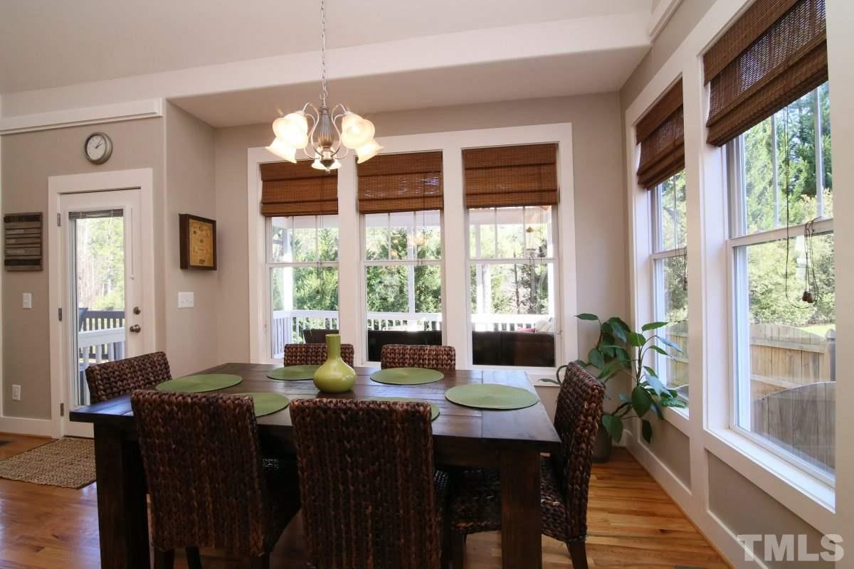 1128 Coram Fields Road Wake Forest, NC 27587 - Photo 11 of 25 Large beautiful windows wrap the back of the house to allow for natural light & a great view of the yard!