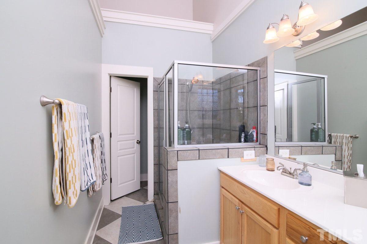 1128 Coram Fields Road Wake Forest, NC 27587 - Photo 15 of 25 Master bath features and large tub, double vanity, separate shower, tile floors & separate toilet room.