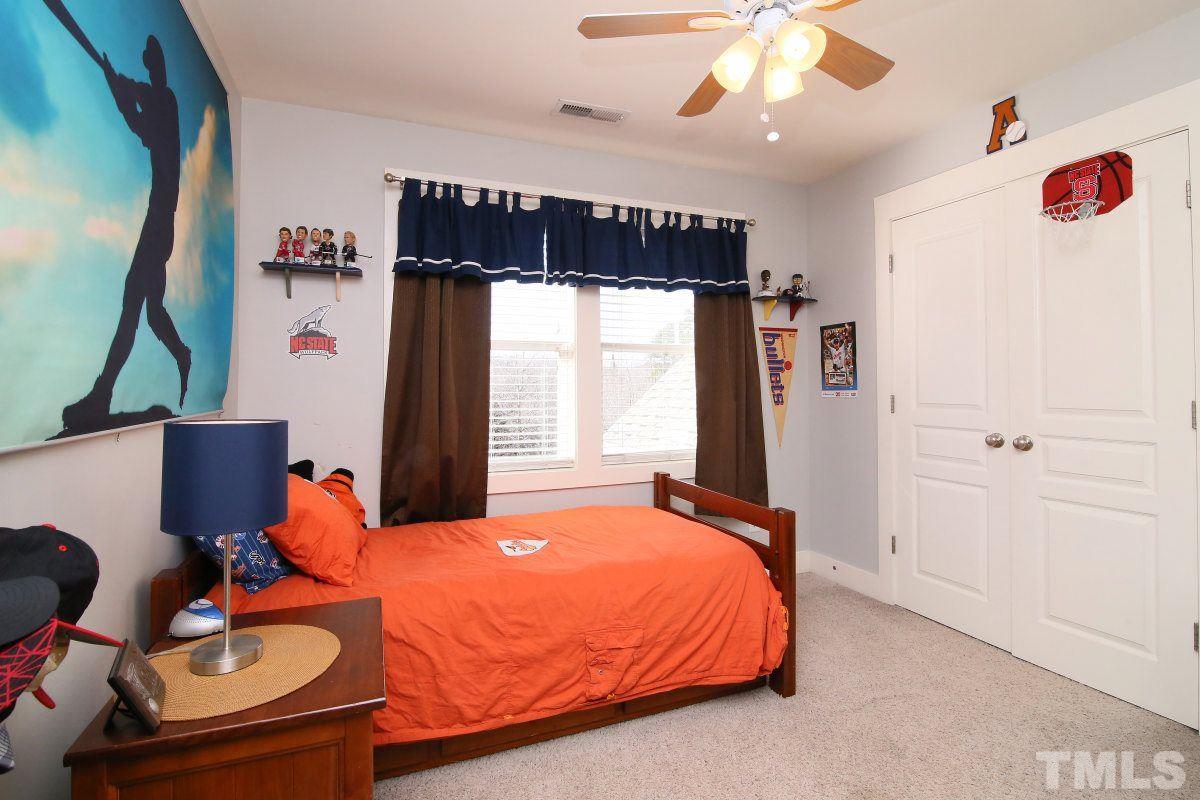 1128 Coram Fields Road Wake Forest, NC 27587 - Photo 18 of 25 Bedroom 4 features, a ceiling fan, double door closet and double windows!
