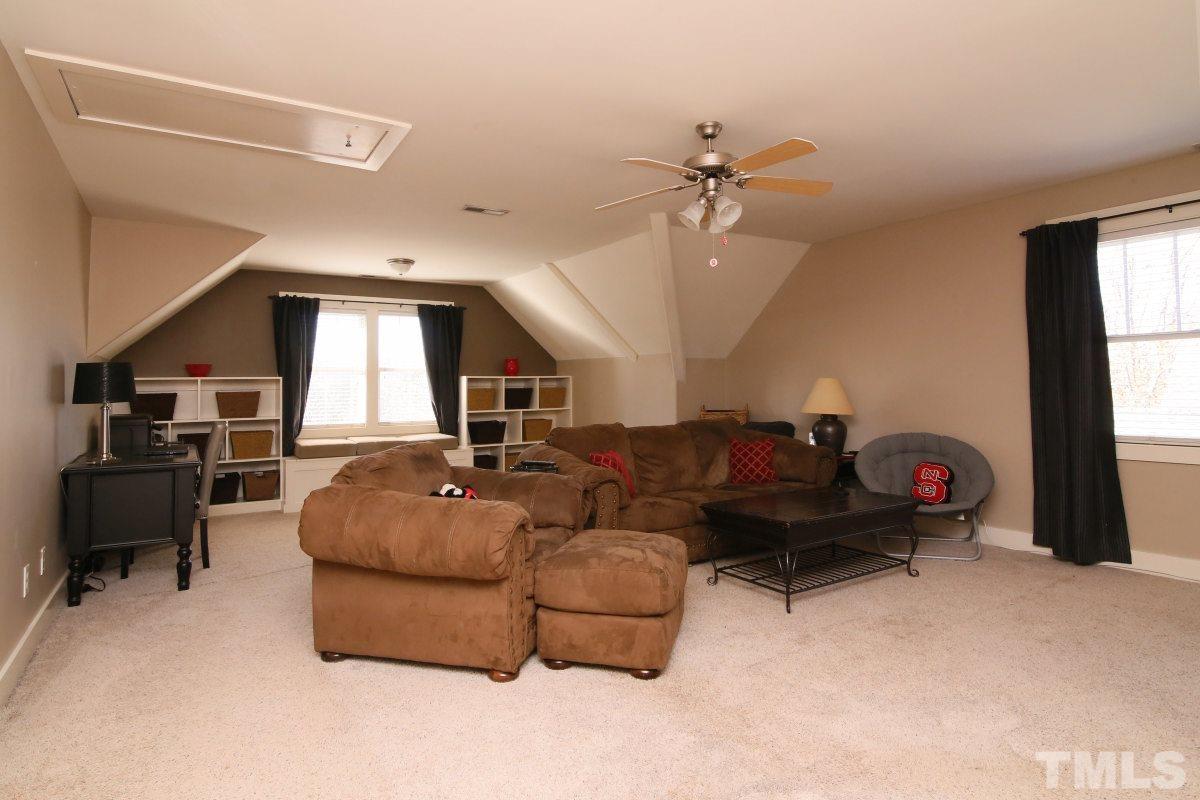 1128 Coram Fields Road Wake Forest, NC 27587 - Photo 19 of 25 This extra large bonus room features a wet bar is a great space and can be used as an office space, family room and workout space!