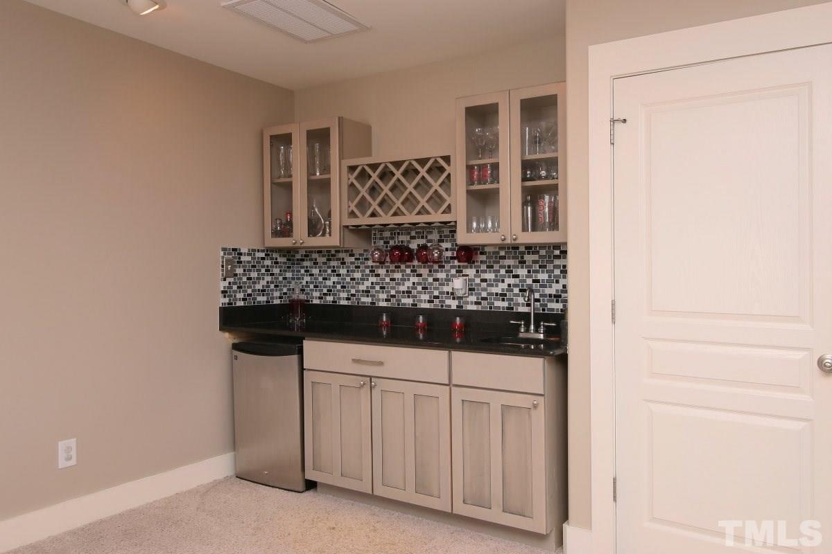 1128 Coram Fields Road Wake Forest, NC 27587 - Photo 20 of 25 This great wet bar is in the bonus room and is great for entertaining or having snacks available for movie time!
